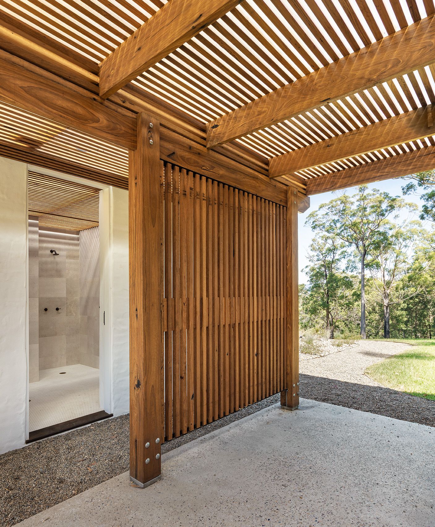 Outdoor shower behind timber battens