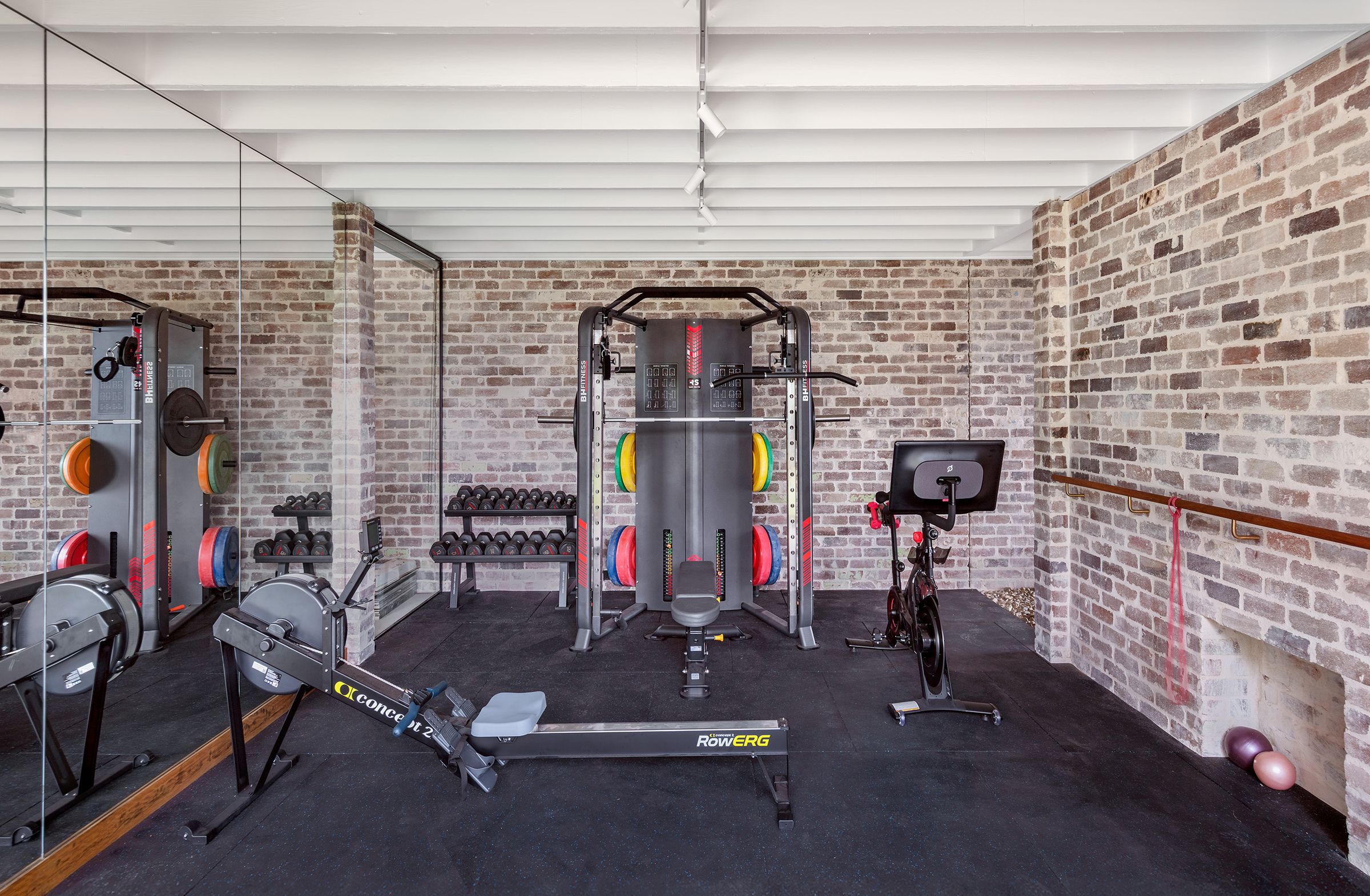 Gym with rowing machine and weights