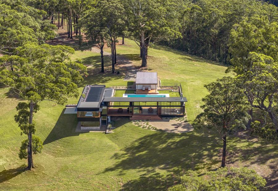 The house in its clearing from above
