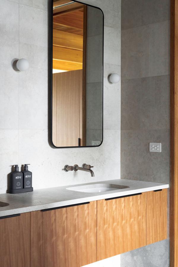 Vanity with a round-cornered mirror