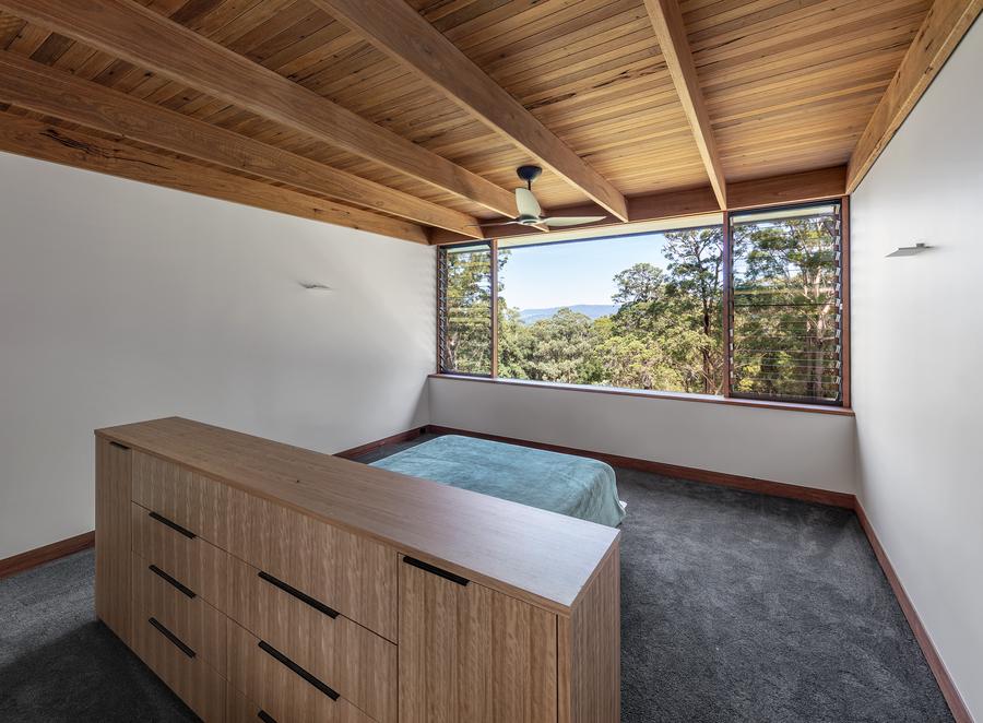 Guest bedroom with timber drawers