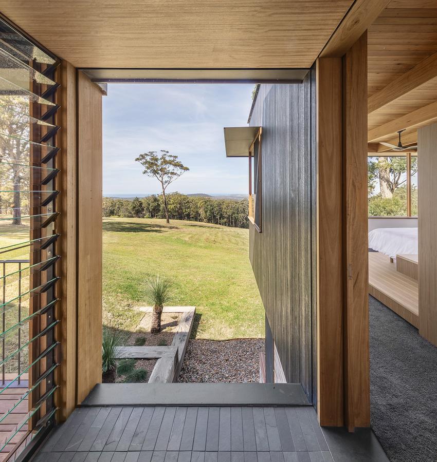Doorway opening to the lawn and coast