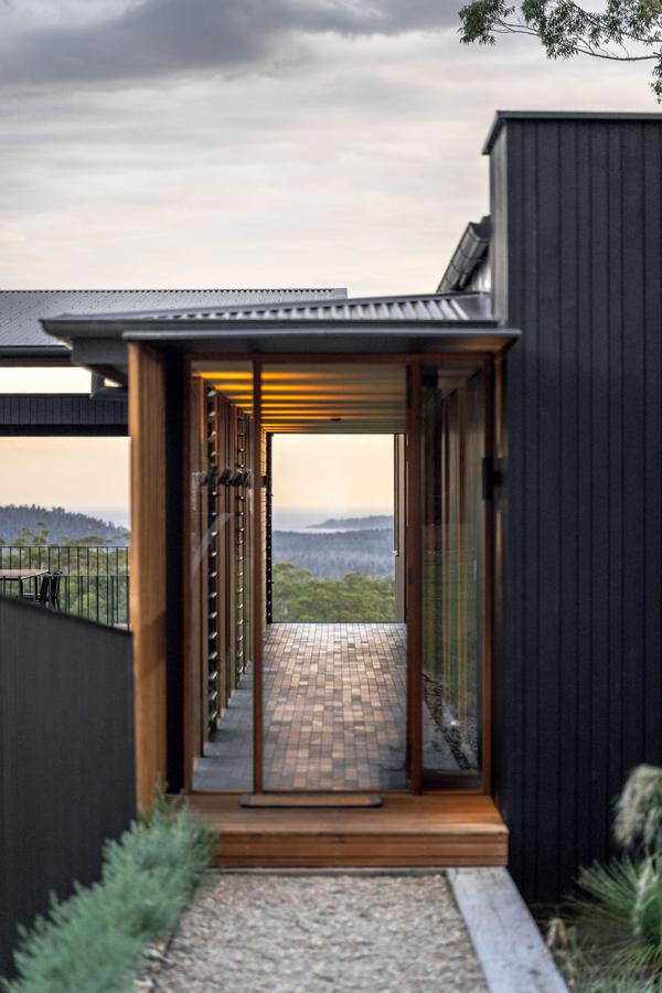 The entry walkway with a framed view to the hills