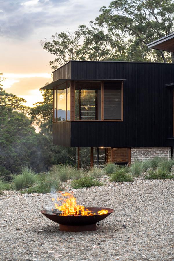 The fire pit lit at dusk