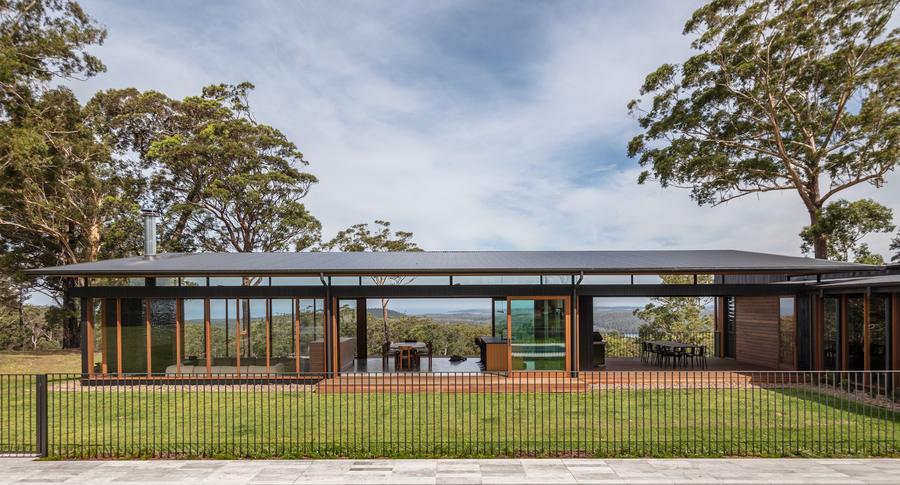 The living pavilion behind the pool fence