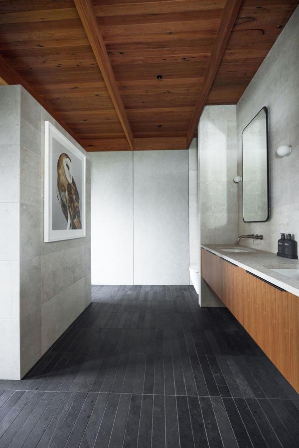 Master bedroom ensuite in stone and timber, winner of a 2026 MBA NSW Southern Regions award