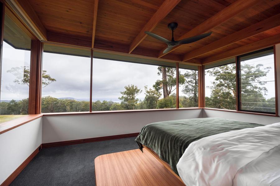 Master bedroom with a corner window