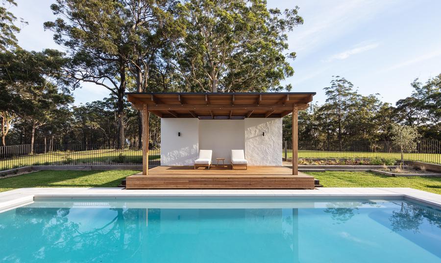 The pool and cabana on a clear day