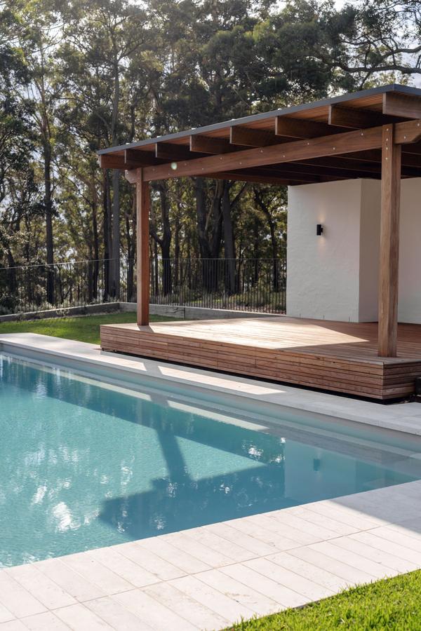 The pool and cabana framed by the bush