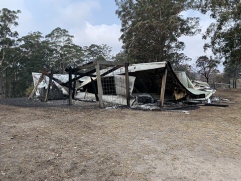 The burnt-out frame of the original building after the 2020 fires